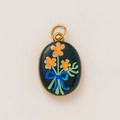 Detailed close-up of oval stainless steel 18K gold pendant with blue floral enamel - Starry Blue Floral Bow Oval Style