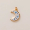 Macro shot of gold-plated crescent moon pendant with blue stars and cream enamel finish - Starry Sky Crescent Pendant (MQPK254807S)