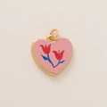 Macro shot of a heart-shaped pink pendant with red tulip patterns and a gold border - Tulip Heart Pendant (MQPK254807S)
