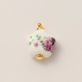 Detailed macro view of white ceramic flower pendant with purple rose patterns and gold clasp - 6 Flowers Vase