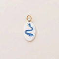 Minimalist white oval pendant with navy blue star pattern and gold hanging ring - No.10 Oval Star Pathway