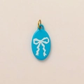 Blue oval charm pendant with white bow pattern and golden metal jump ring - No.2 Oval Blue Bow