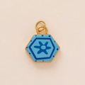 Close-up of hexagonal blue enamel pendant with star pattern and gold plated frames - Blue Flower Hexagon Pendant