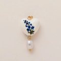 Detail of heart pendant with blue floral patterns and hanging white pearl charm - July Heart Flower (Pendant Only)