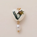 Detail of heart-shaped ceramic pendant with yellow floral patterns and a teardrop pearl - March Heart Flower (Pendant Only (Without Chain))