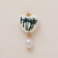 Detail view of heart-shaped ceramic charm with blue floral pattern and drop pearl pendant - December Heart Flower (Pendant Only (Without Chain))