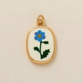 Detail of 18k gold plated oval pendant with blue floral enamel on white base - February Flower Pendant / 1 Piece