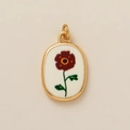 Detail of 18k gold plated oval pendant featuring a hand-painted red flower on white enamel - August Flower Pendant / 1 Piece