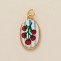 Macro detail of oval gold pendant featuring hand-painted red tomato on blue striped base - Tomato Vine Pendant