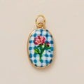 Macro view of oval pendant featuring pink rose on blue checkered pattern with gold frame - Oval (Blue Plaid) / Red Rose Plaid Pendant