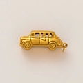 Macro shot of 18K gold plated vintage car pendant charm with detailed metal textures - Vintage Car / Gold