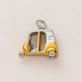 Detailed macro view of a two-tone rickshaw pendant in gold and silver stainless steel - Tricycle / Color Block