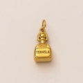 Macro detail of a 18K gold plated tequila bottle pendant with engraved text - Bottle Pendant