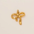 Macro detail of 18K gold-plated bow charm with high-polished mirror finish and closed loop - Bow Pendant Style G