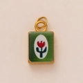 Detailed macro of vintage rectangular 18k gold pendant with red tulip and green enamel - Rose Green Square Pendant