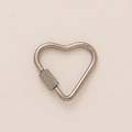 Detailed macro view of heart-shaped stainless steel carabiner with knurled screw lock - No. 1 Spring Ring