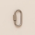 Macro detail of oval stainless steel quick link connector with a hexagonal screw locking nut - No. 4 Spring Ring