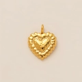 Macro detail of a 18K gold-plated heart pendant with unique hammered textured finish - Heart Pendant