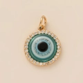 Close-up of a gold-plated circular Evil Eye pendant with white pavé cubic zirconia - No.13 Evil Eye Pendant