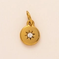 Detail of 18K gold plated stainless steel birthstone pendant with starburst engraving - April Birthstone Pendant