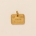 Detailed macro view of gold-plated rectangular charm with Italy engraved text and sun pattern - Gold Tag Pendant