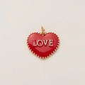 Close-up of heart-shaped red enamel pendant with gold LOVE lettering and beaded edge - LOVE Heart Pendant