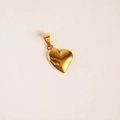 Detailed view of heart-shaped gold-plated pendant with polished metallic surface finish - Slanted Heart Pendant