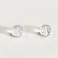 Macro shot of clear silicone earring back replacements for securing jewelry posts - Silicone Back