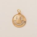 Macro detail of 18K gold plated round smiley face pendant with sparkling white zirconia - Smile Face Pendant