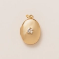 Detailed view of an oval 18K gold-plated locket with three central sparkling zircons - Oval Locket Opening Pendant