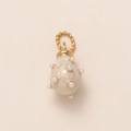 Detail of egg-shaped 18K gold pendant with white pearls and cream enamel surface - Pearl Egg Pendant