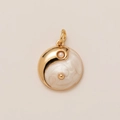 Macro view of 18K gold Yin Yang pendant with white pearl and mother of pearl texture - Tai Chi Yin Yang MOP Pendant
