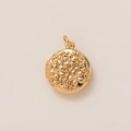 Detailed close-up of a round 18K gold locket pendant with intricate floral engravings - Round Floral Engraved Locket Pendant