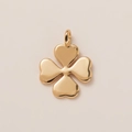 Polished 18K gold four-leaf clover pendant with heart-shaped leaves on a smooth surface - Polished Clover Pendant