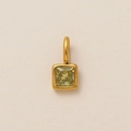 Detailed view of square 18K gold-plated pendant with a light yellow-green gemstone - August Birthstone Pendant / Gold