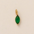 Marquise-cut green gemstone pendant with a gold-tone bail on cream textured paper - May Birthstone Pendant