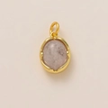 Detailed view of an oval pink natural stone pendant with gold-plated edge and top ring - Natural Stone Pendant