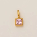 Macro detail of a square light pink zircon pendant in an 18K gold plated steel setting - October Birthstone Pendant / Gold
