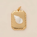 Macro detail of a gold rectangular pendant with a 3D white conch shell and ribbed edges - Rectangular Shell Plate