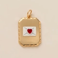 Close-up of gold envelope pendant featuring white enamel and a red heart gemstone - Envelope (Gold)