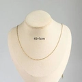 Golden birthstone chain necklace 45+5cm length displayed on a jewelry mannequin bust - O Chain