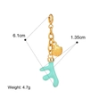 Detail view of gold shell and mint green coral pendant showing 6.1cm length and 4.7g weight - Coral