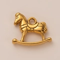Macro detail of 18K gold plated stainless steel rocking horse pendant for jewelry making - Horse