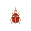 Macro shot of 18k gold plated scarab beetle pendant with an oval red gemstone inlay - Beetle Pendant