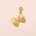 Elegant 18K gold-plated farfalle pasta pendant with spring clasp on beige background - Bowknot Charm