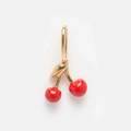 Detail of red cherry pendant with 14K gold leaf and smooth enamel finish for jewelry making - Cherry