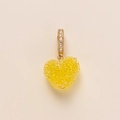Detailed close-up of a heart pendant with yellow crystals and diamond-set gold bail - Yellow Heart Pendant