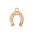 Macro detail of 18K gold plated horseshoe pendant with embossed texture and metal ring - Horseshoe