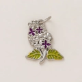 Close-up of a floral pendant with purple petals and green leaves in 18K gold finish - Violet Flower Pendant / Silver