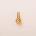 Macro shot of 18K gold plated spherical charm with textured dotted details and loop - Sorbet Pendant